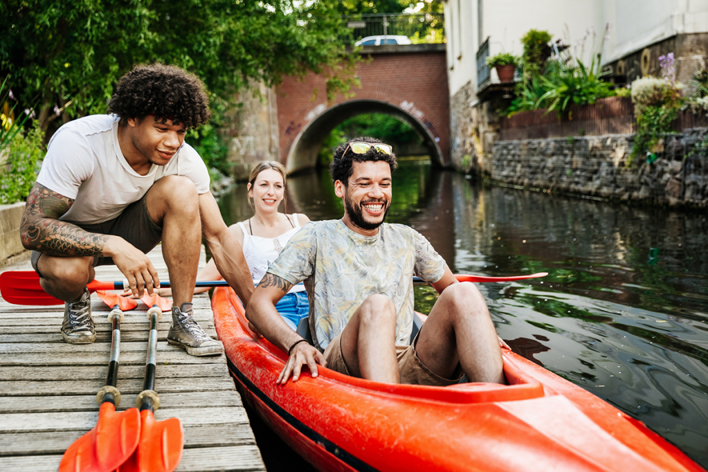 man and woman in kayak on vacation