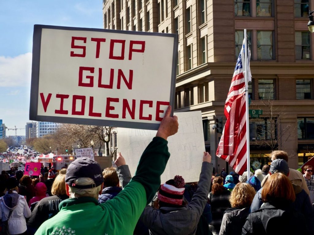 crowd march against gun violence use