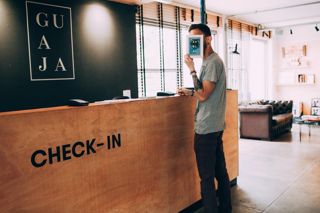 Customer at hotel reception desk