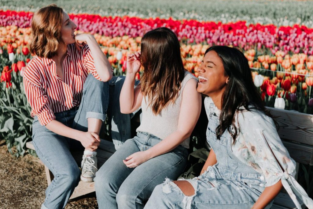 A trio of travelers relaxing in a garden