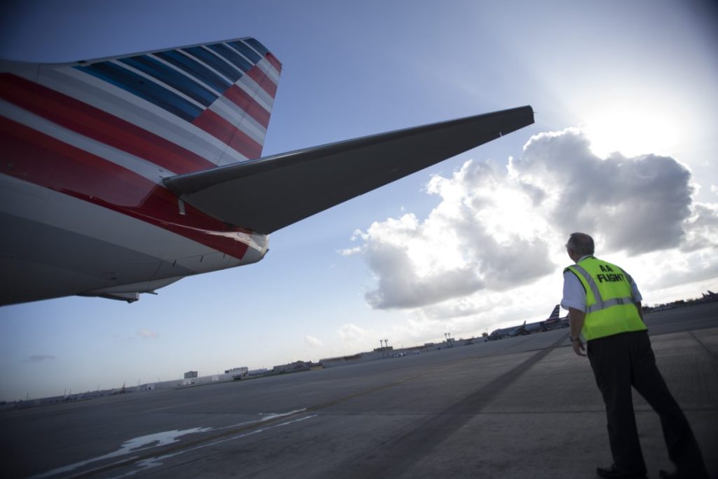 american airlines Pilots checking-aircraft-tail-before-flight source american airlines