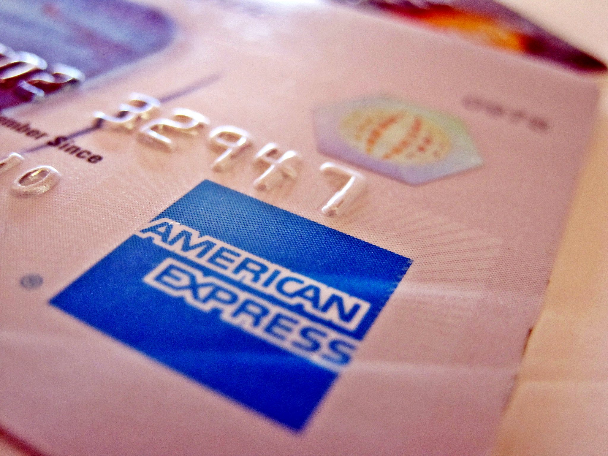 Despite growth in travel and economic spending, American Express faces a murky economic outlook. 