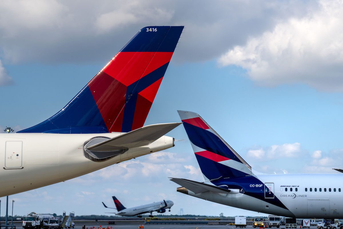 Travel and entertainment spending increased 39 percent in the first quarter of this year. Pictured are Delta Air Lines and Latam Airlines tails at New York's JFK airport. Source: Latam Airlines Group  