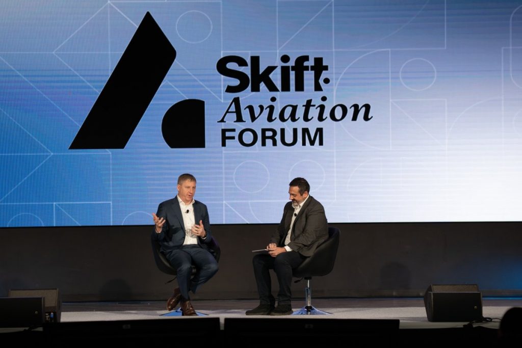 Azul Brazilian Airlines CEO John Rodgerson talking with WestJet Aviation Advisor and Board Member Alex Cruz at Skift Aviation Forum 2022 in Dallas-Fort Worth. Source: Skift.