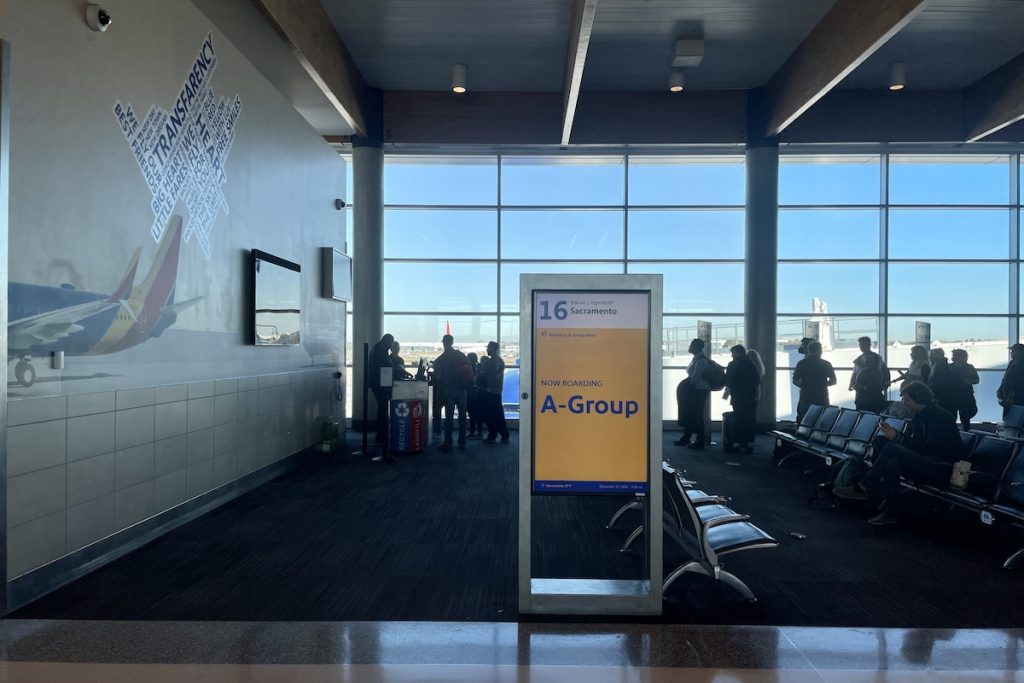 Travelers board a Southwest flight