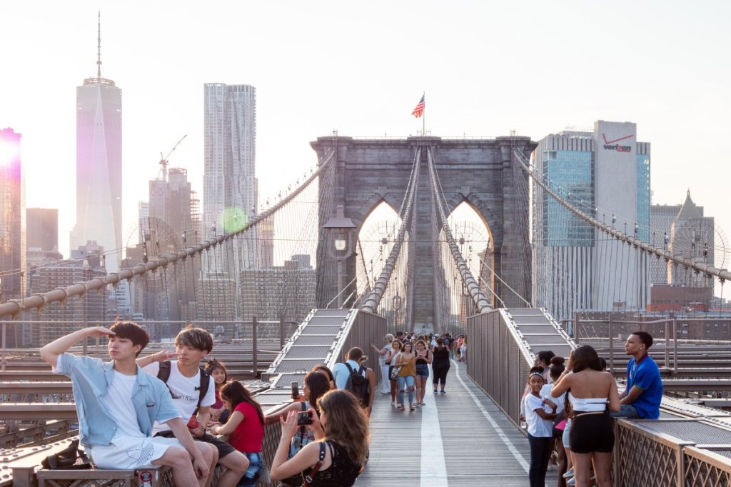 Tourists on the Brooklyn Bridge in New York City, United States.