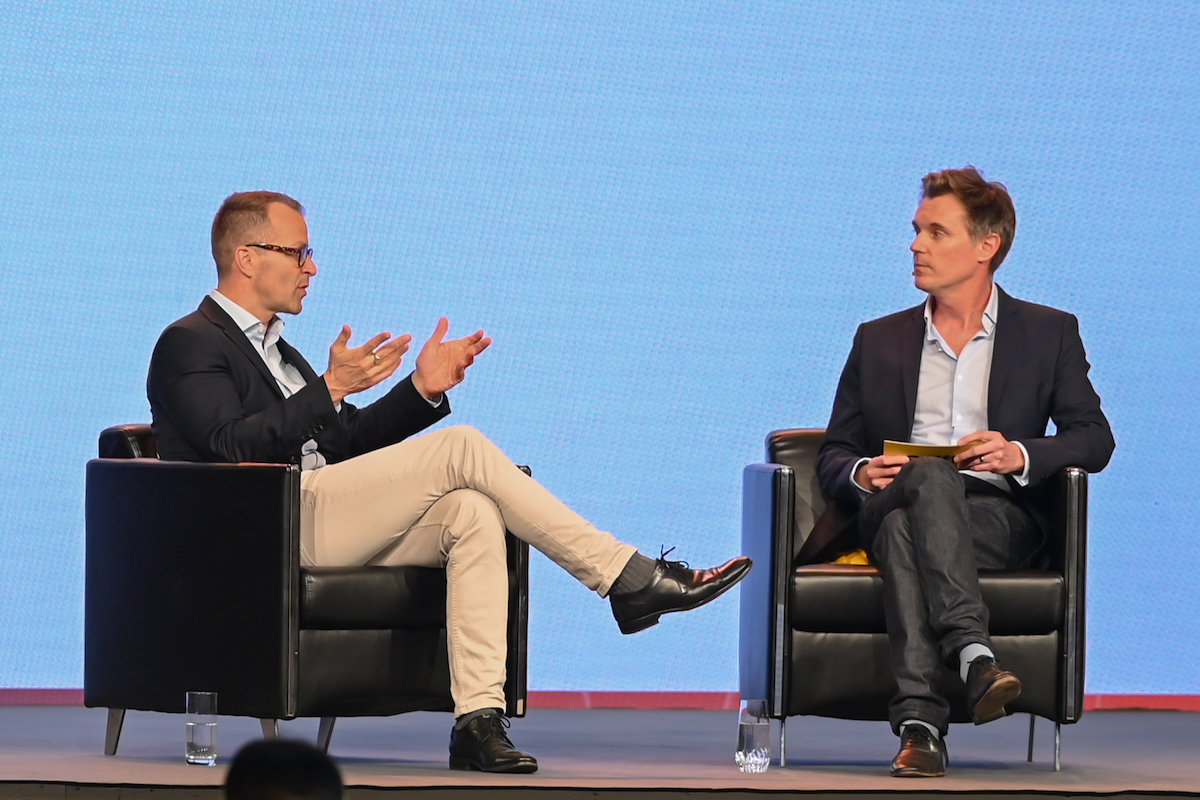 Casper Urhammer, CEO of tour operator FTI Group, on stage with Skift Corporate Travel Editor Matthew Parsons at Skift Global Forum East in Dubai 