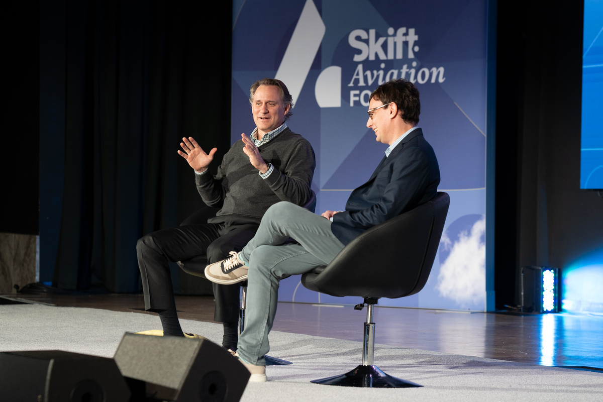 Sun Country CEO Jude Bricker in discussion with Skift Editor-at-Large Brian Sumers at Skift Aviation Forum in Dallas