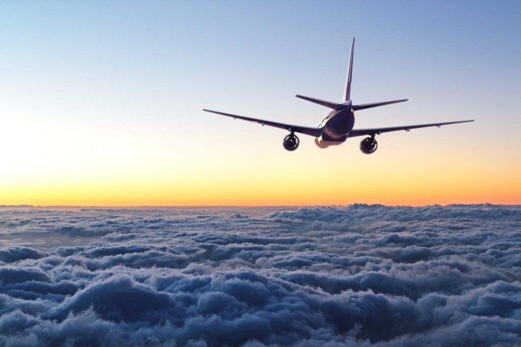 plane flying away in the sky