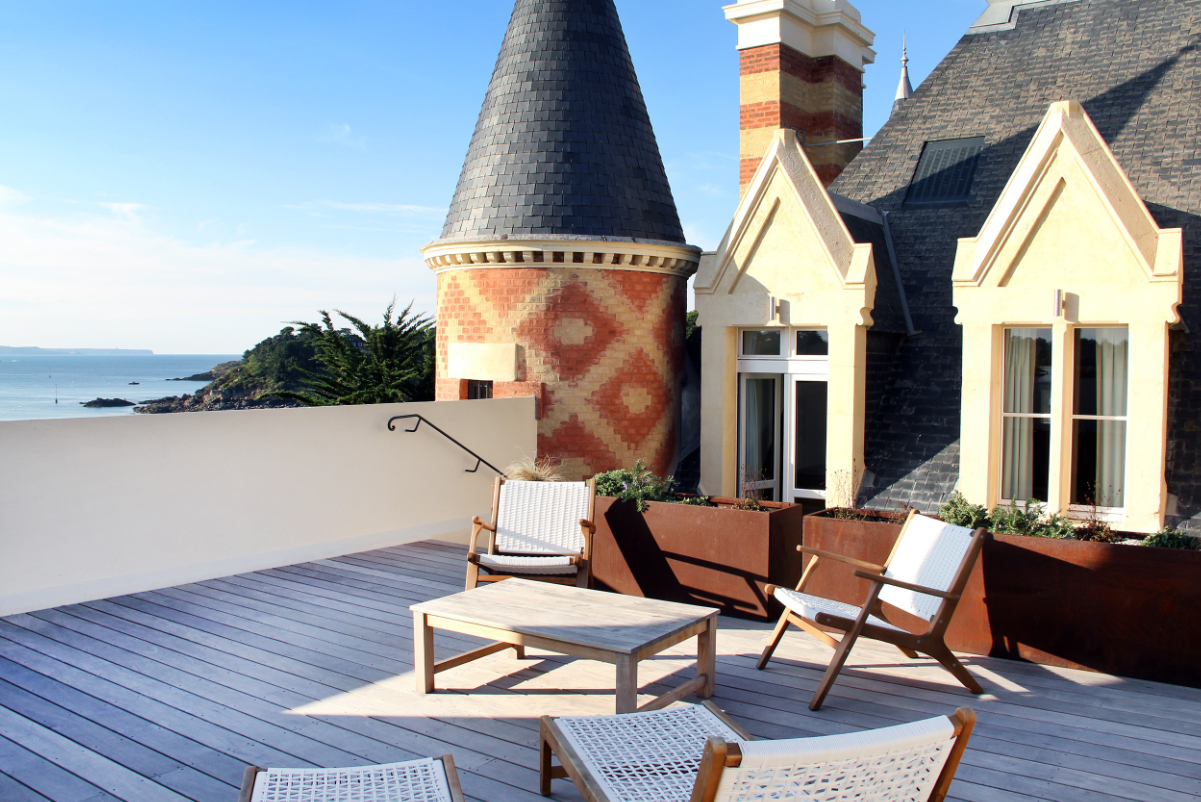 A view of a terrace at Château Le Nessay, on the Emerald Coast of Brittany, France, which is one of the hotels that’s a part of the Small Luxury Hotels Private Collection. Source: Small Luxury Hotels of the World.