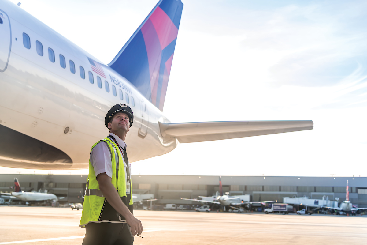 A Delta Air Lines pilot on the ramp inspecting a plane in early 2022. Source: Delta Air Lines.