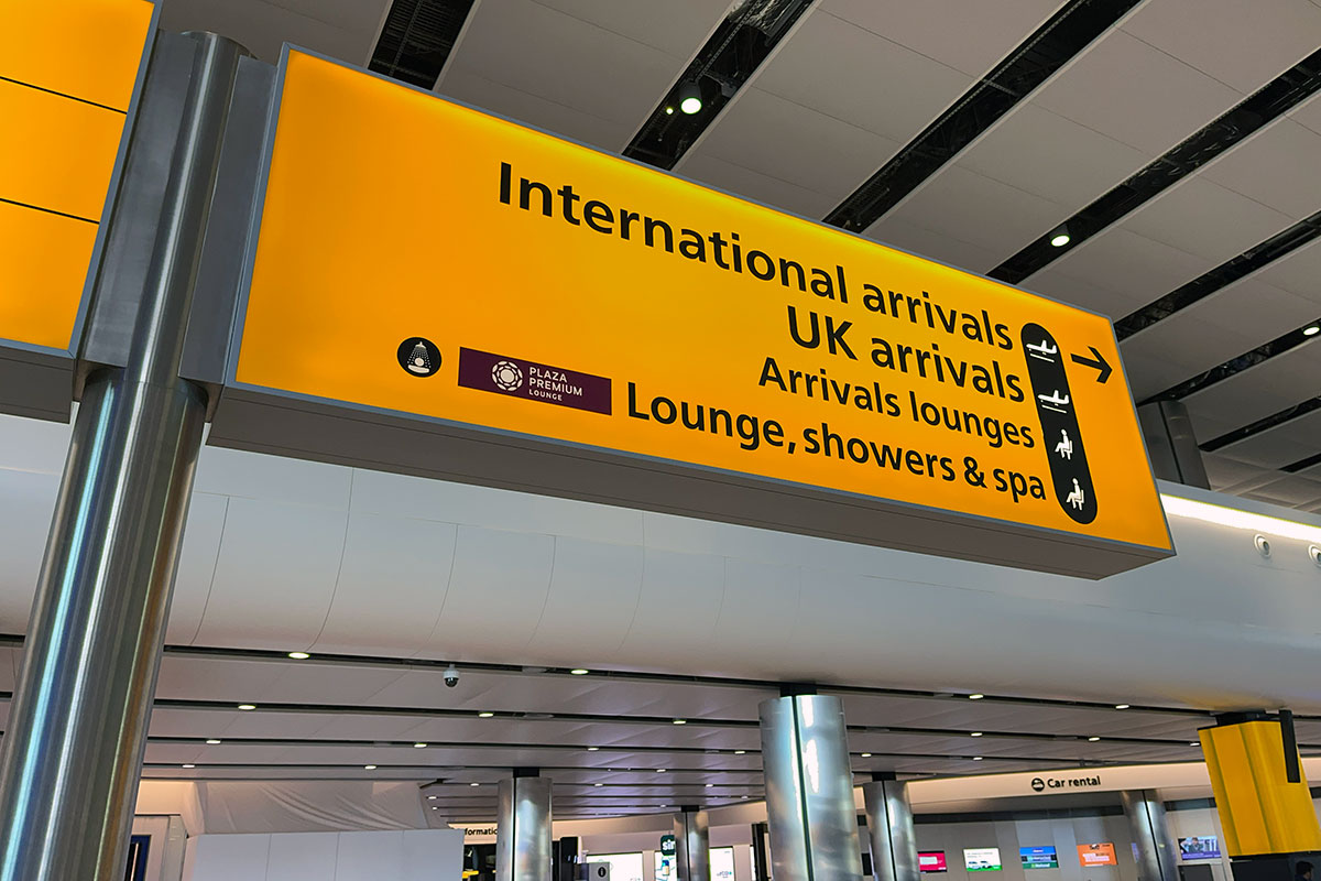 A directional sign inside Heathrow Airport Terminal 2 outside London, England. 