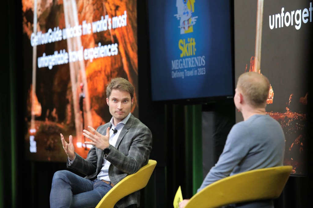 Johannes Reck being interviewed on stage