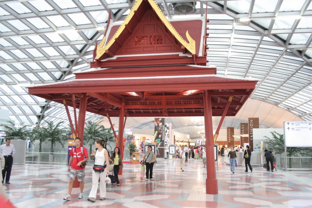 Travelers walk through Bangkok's Suvarnabhumi airport.