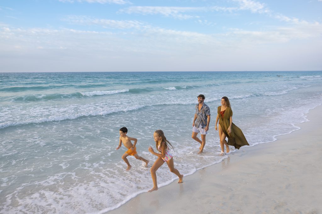 A family enjoys the beaches of Saadiyat Island.