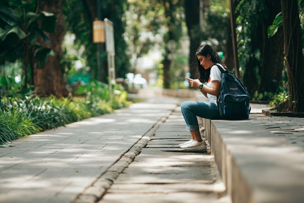Tourist on mobile phone. Generative AI will impact Travel Agents and Tour Operators as it rapidly evolves. Source: Unsplash.