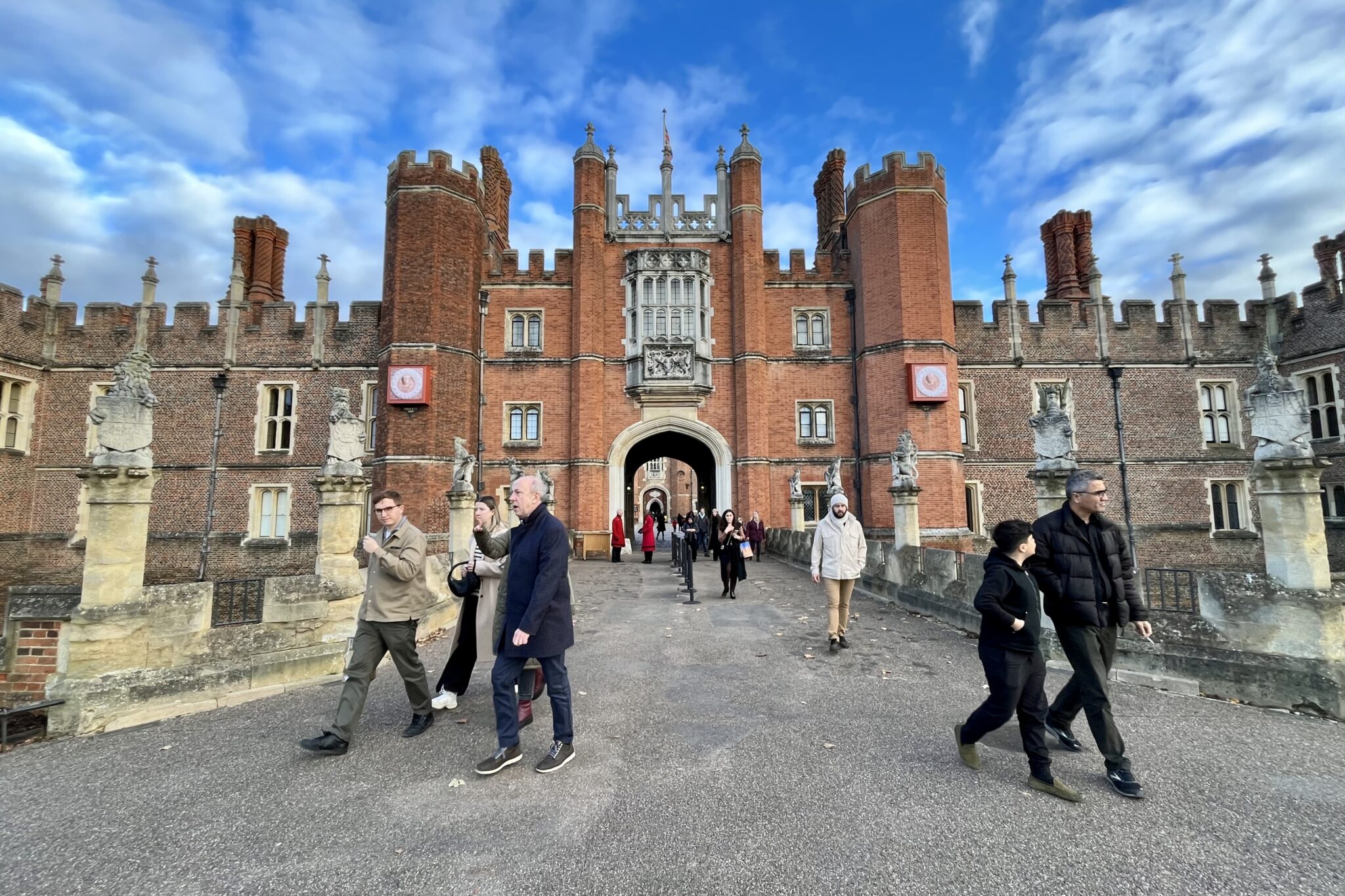 Tourists outside of Hampton Court Palace outside London, England. The palace is a setting for the Netflix show Bridgerton. 