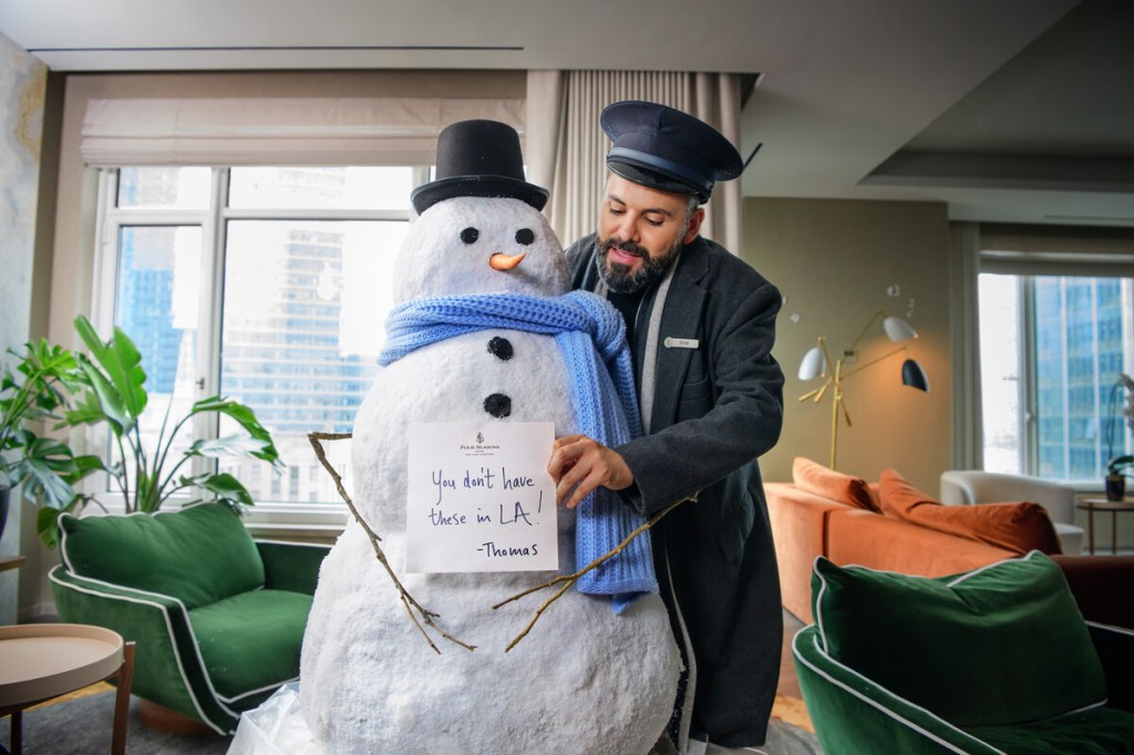 Four Seasons Employee With a Snowman