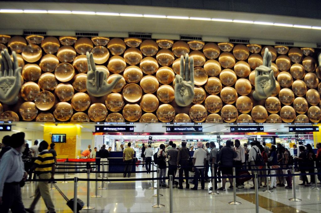 Namaste finger signs sculpture above Customs at Delhi international airport.