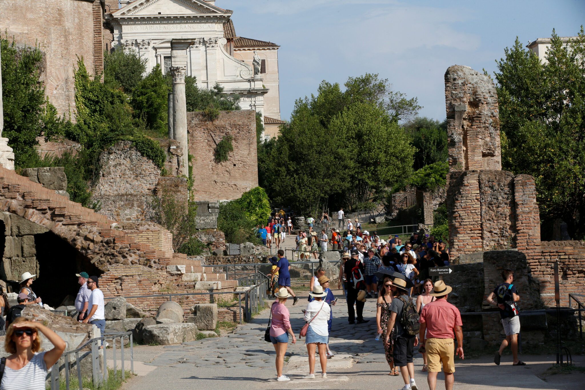 Tourists walk along the Roman Forum. Source: Reiuters