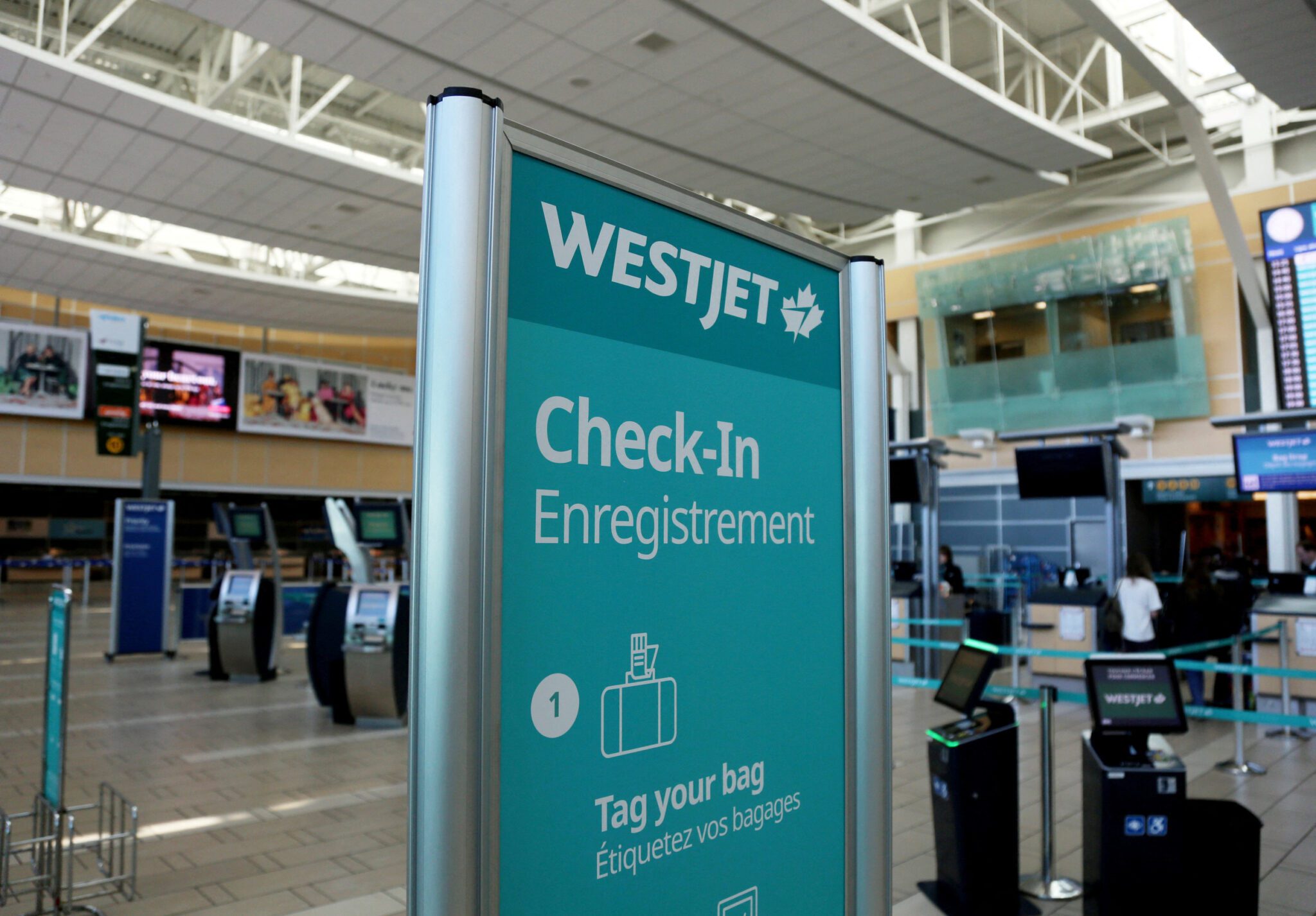 A check-in counter for WestJet. The airline has an agreement to raise pilot pay over next four years. 