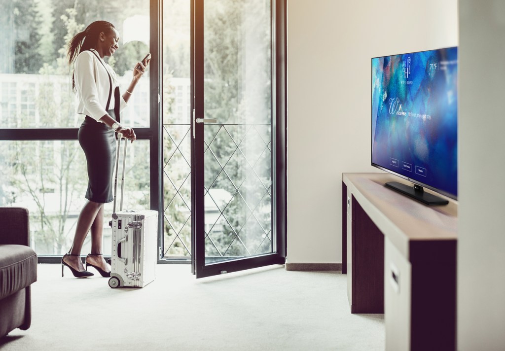 A businesswoman in a hotel room