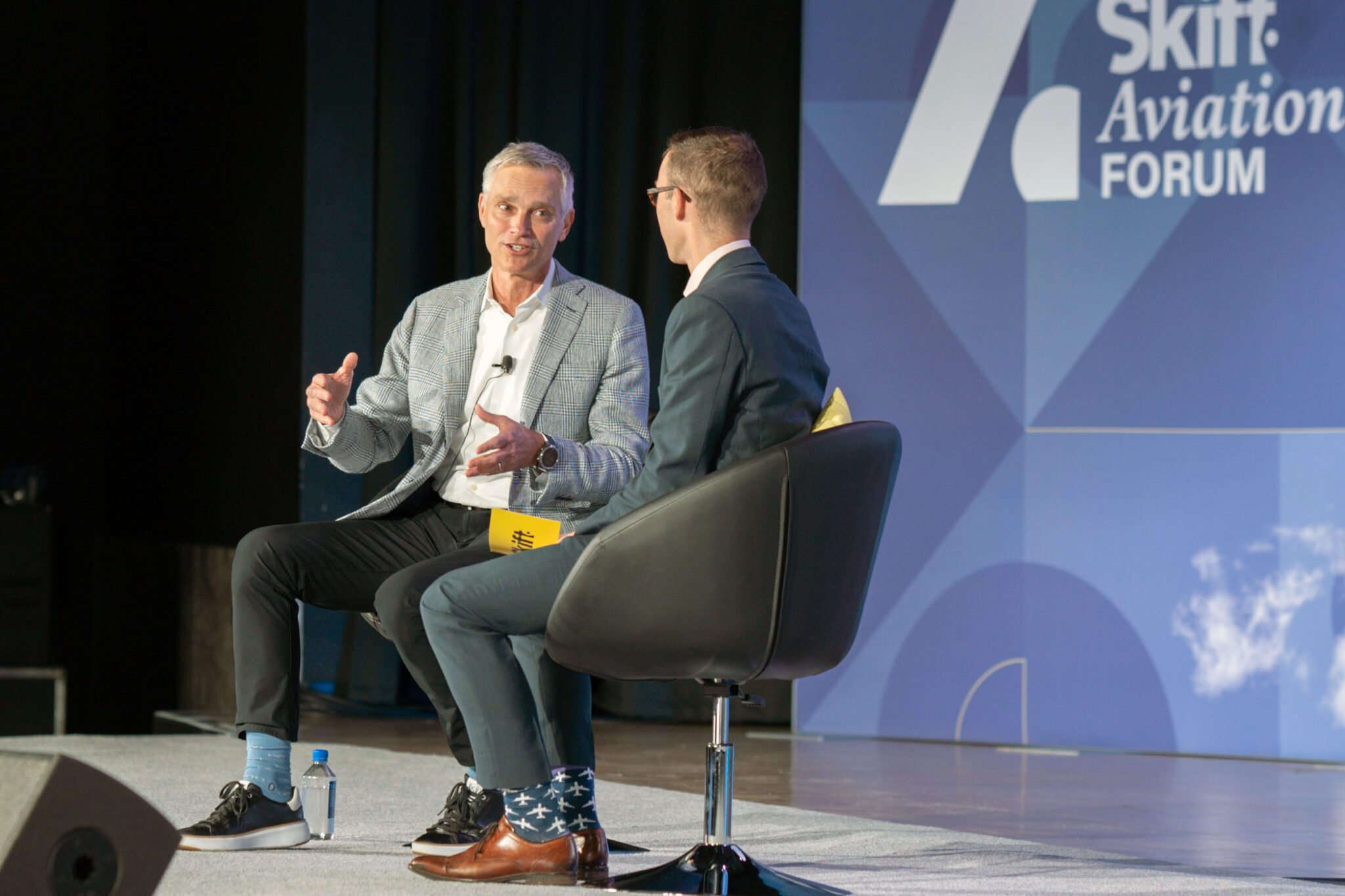 American Airlines CEO Robert Isom (left) speaking on stage at Skift Aviation Forum in Dallas, Texas, November 2022. 