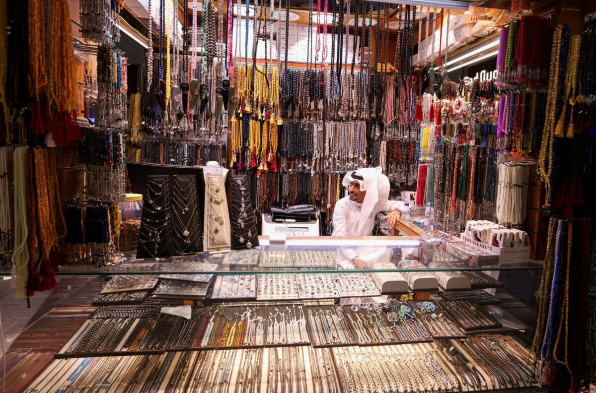 A seller waits for pilgrims in his shop at El Saa mall as pilgrims start arriving to perform the annual hajj in the Grand Mosque in Mecca.