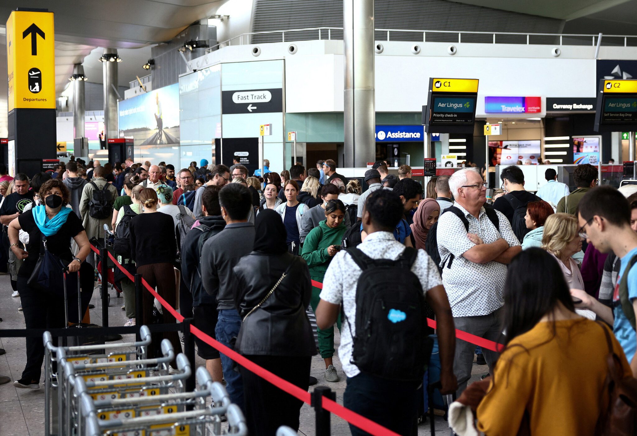 Passengers in line at Terminal 2 at Heathrow Airport in London. 