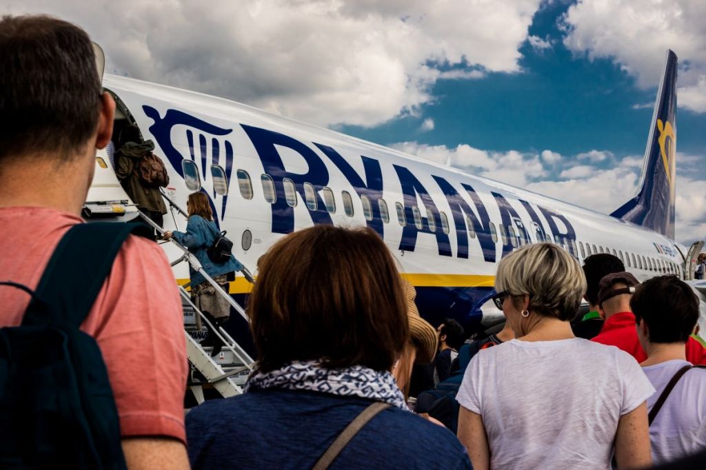 Passengers entering a Ryanair aeroplane