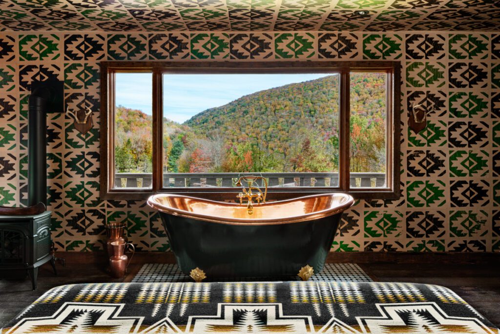 bathtub in guestroom at boutique hotel Urban Cowboy catskills during the fall