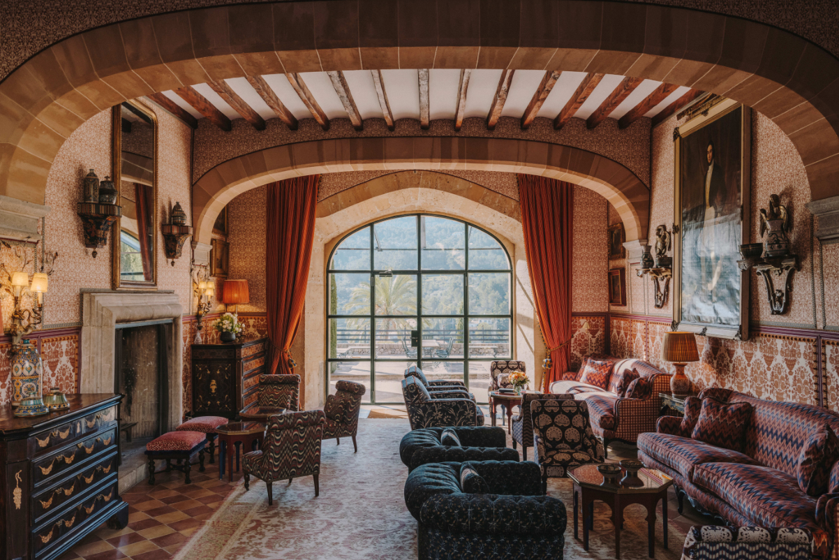 The chimney room of the Grand Hotel Son Net, a palace hotel that opened in Mallorca in May. Source: Cortesín Hotels.