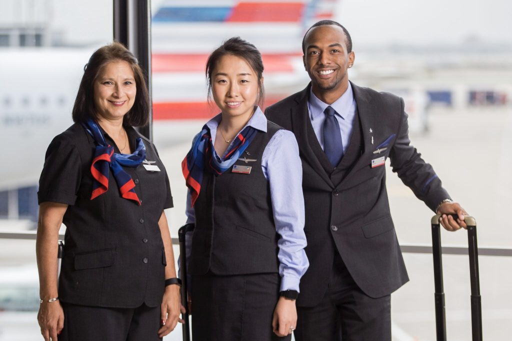 Three American Airlines flight attendants insid3 a Chicago airport.