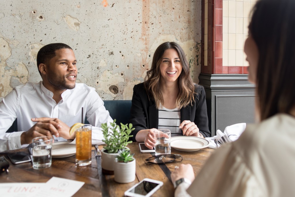 business travelers buying lunch within policy guidelines