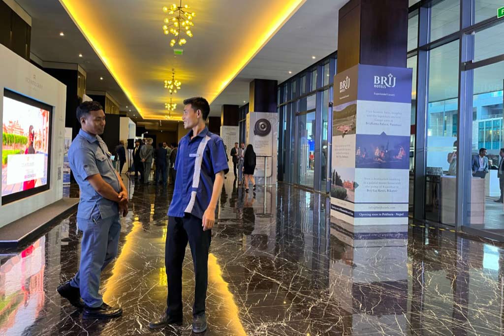 Staff walking the floor of an event at a hotel in Bengalaru, India.