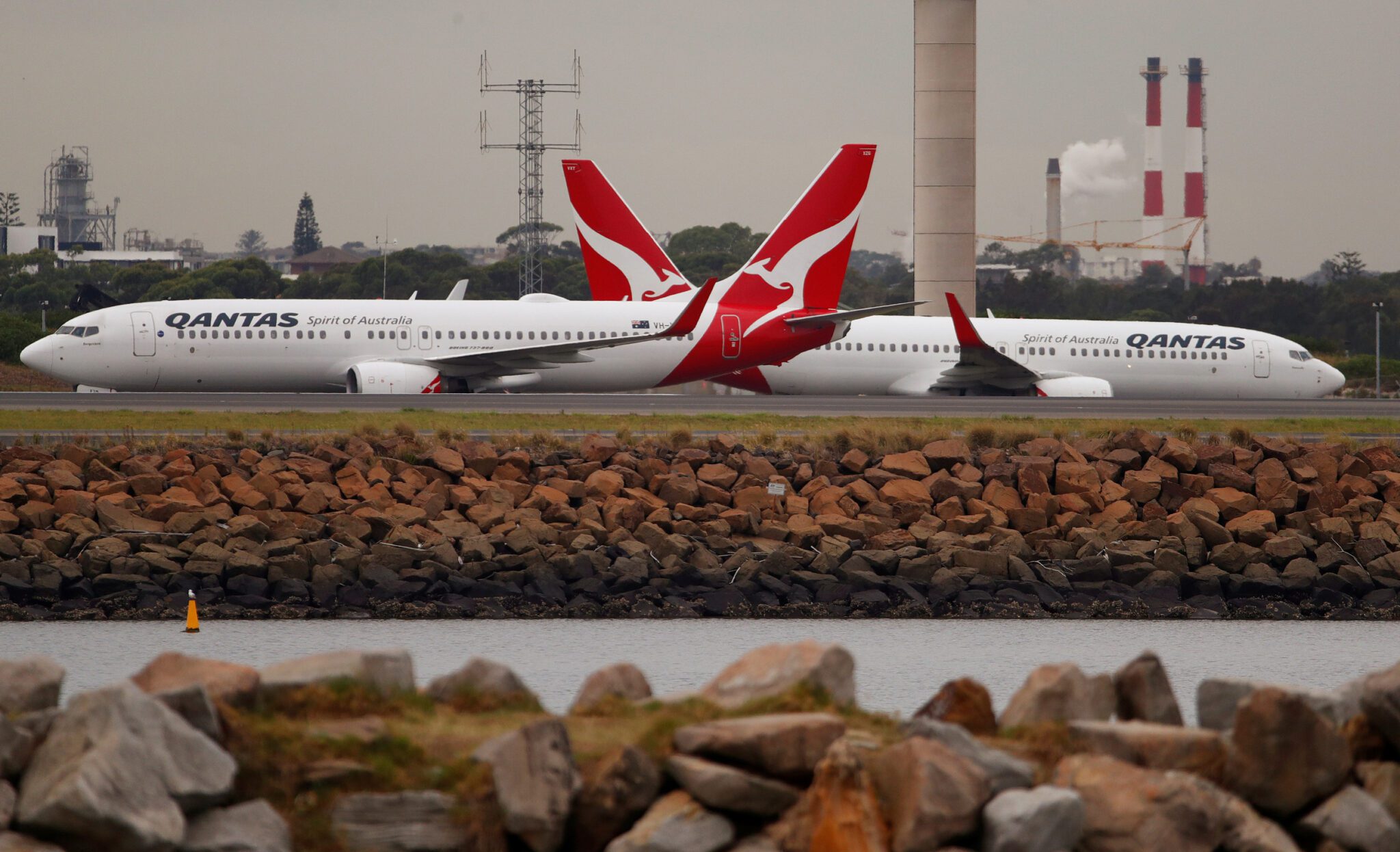 Qantas Boeing 737s taxi at Kingsford Smith International Airport in Sydney, Australia. Source: Reuters