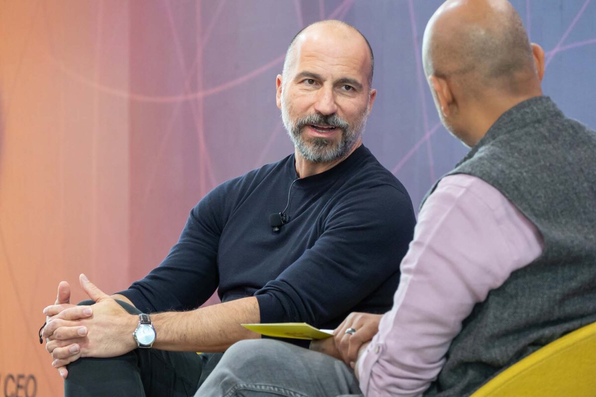 Dara Khosrowshahi seated on stage while being interviewed
