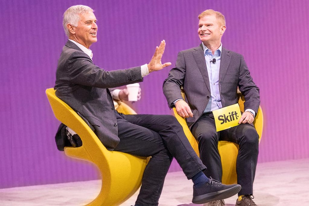 Chris Nassetta seated on stage at Skift Global Forum