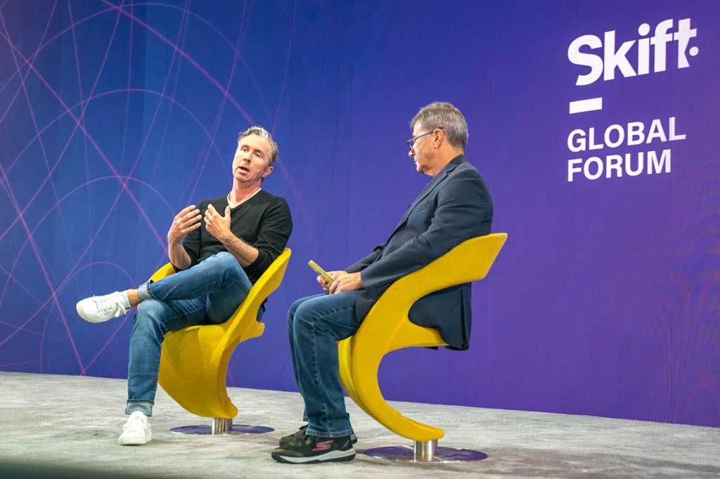 Hopper founder and CEO Fred Lalonde sitting on stage with Skift Executive Editor Dennis Schaal at Skift Global Forum 2023 in New York City