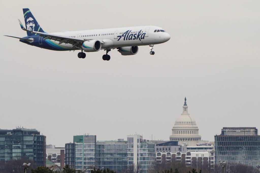 An Alaska Airlines aircraft lands at Reagan National Airport in Arlington Virginia