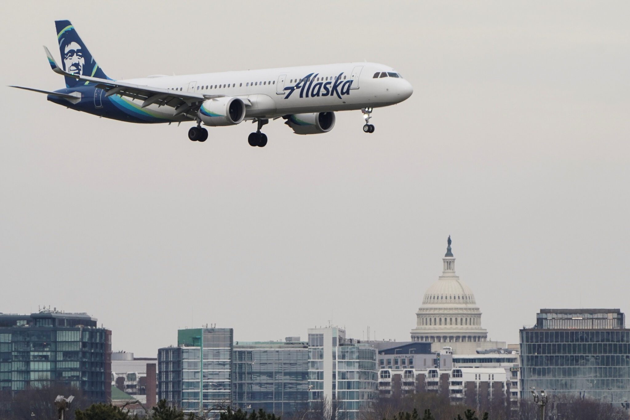 An Alaska Airlines pilot was charged with trying to disable the engines of a jet in flight. He told police afterward he was suffering a nervous breakdown.