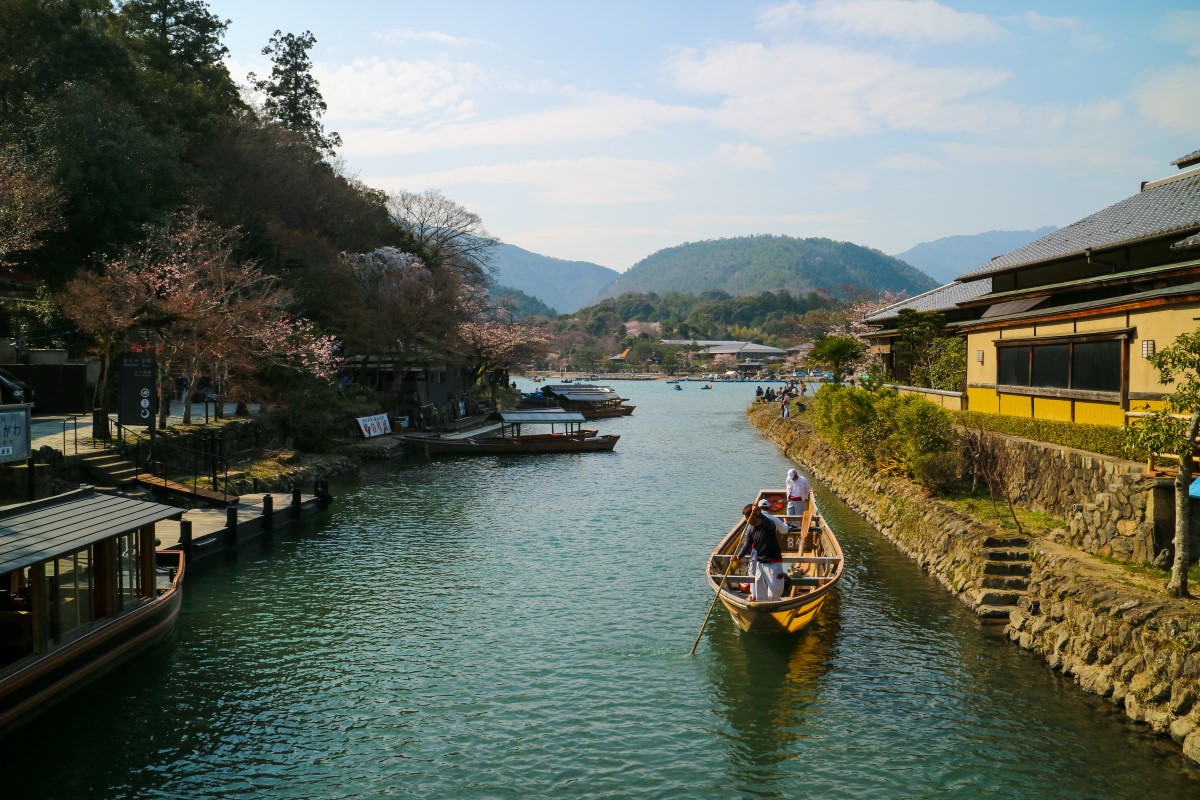 A boat cruises along Katsura River in Japan.