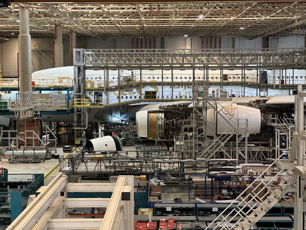 Emirates A380 at Emirates Engineering Hangar in Dubai alongside new Premium Economy seat installation