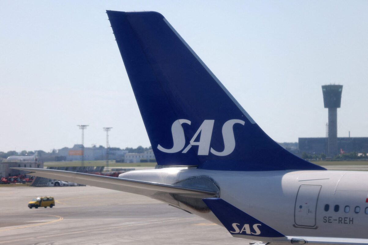The tail fin of a parked Scandinavian Airlines (SAS) airplane is seen on the tarmac at Copenhagen Airport Kastrup in Copenhagen, Denmark, July 3, 2022. Photographer: Andrew Kelly. Source: Reuters. 
