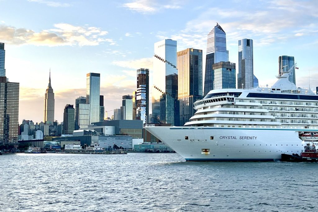 A ship in the foreground and the New York City skyline behind it