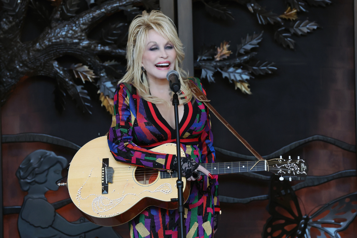 Dolly Parton sings during the Grand Opening event for Dollywood’s HeartSong Lodge & Resort on November 2, 2023 in Pigeon Forge, Tennessee. Photo by Curtis Hilbun. Source: The Dollywood Company.