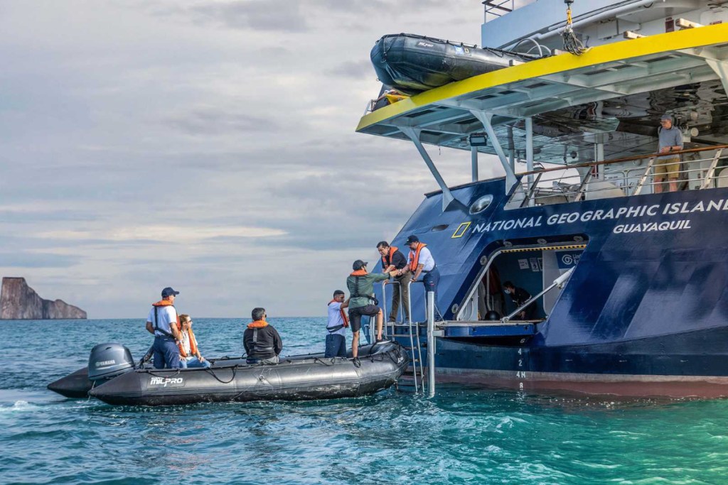 adventure tourists boarding a lindblad expeditions ship islander ii