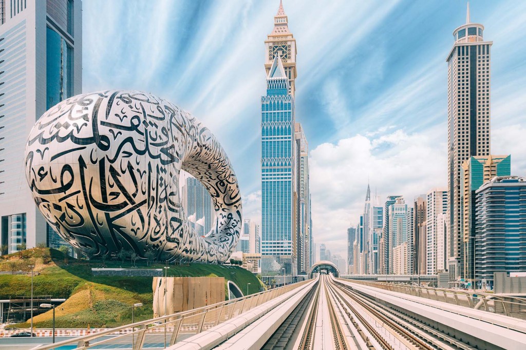 Metro railway among among glass skyscrapers in Dubai.