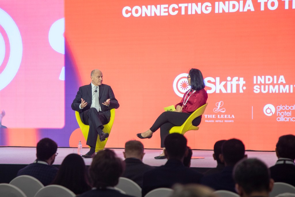 a man and a woman speaking on stage