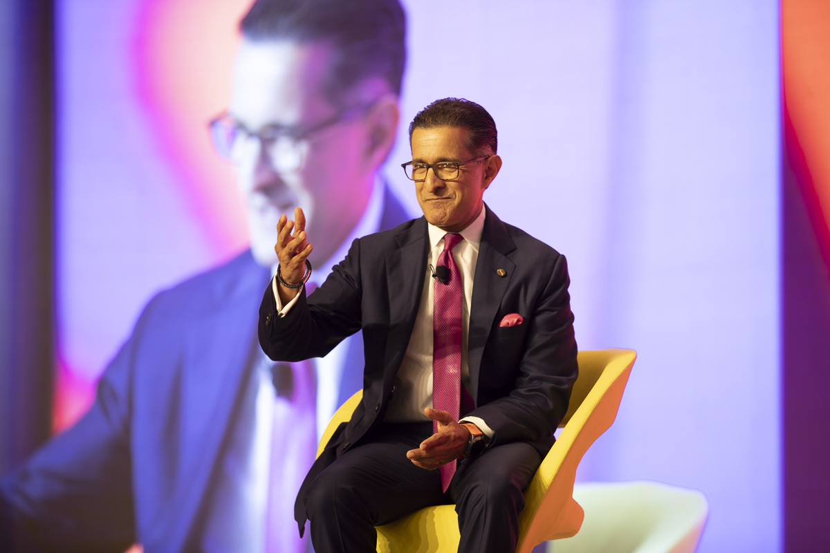 Vikram Oberoi, managing director and CEO of Oberoi Group, on stage at Skift India Summit in Delhi-NCR on March, 20, 2024, talking with Skift's Sean O'Neill. Source: Skift.